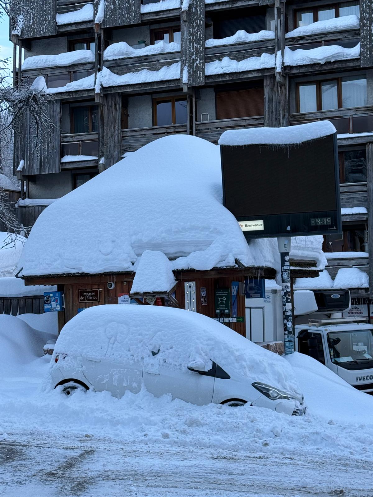 Car buried under a thick layer of snow in Risoul 1850